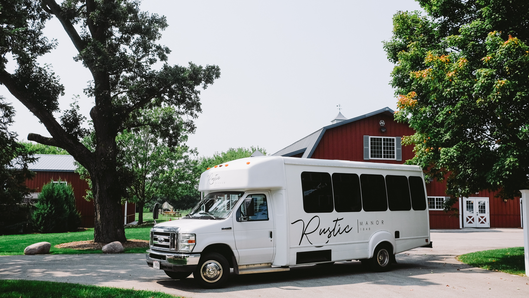 The Rustic Manor shuttle sits outside the business.