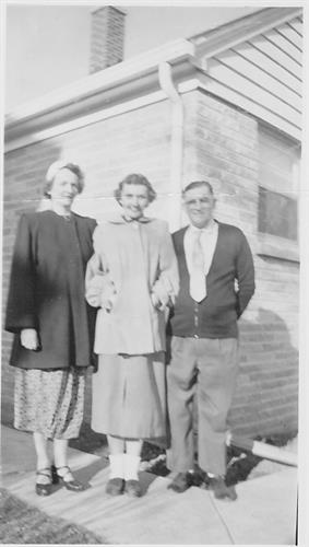 June Riess with her parents in the 1950s.