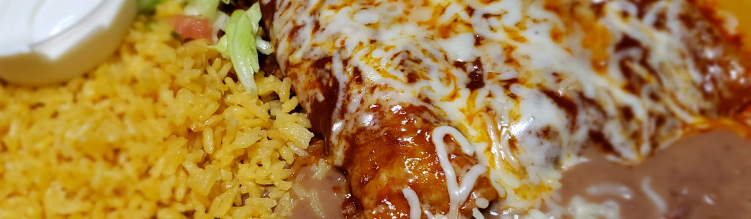 Enchilada dinner with rice and beans
