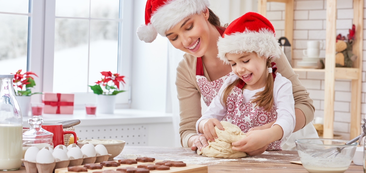A mother and daughter bake at the holidays.