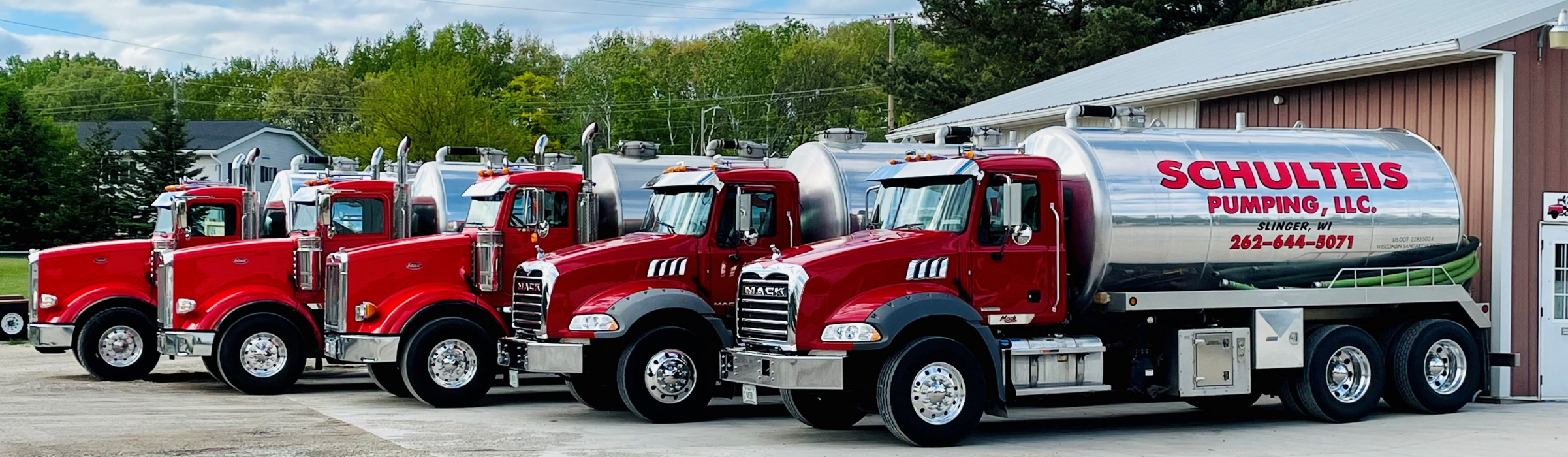 Photo of Schulteis Pumping trucks lined up in a row.