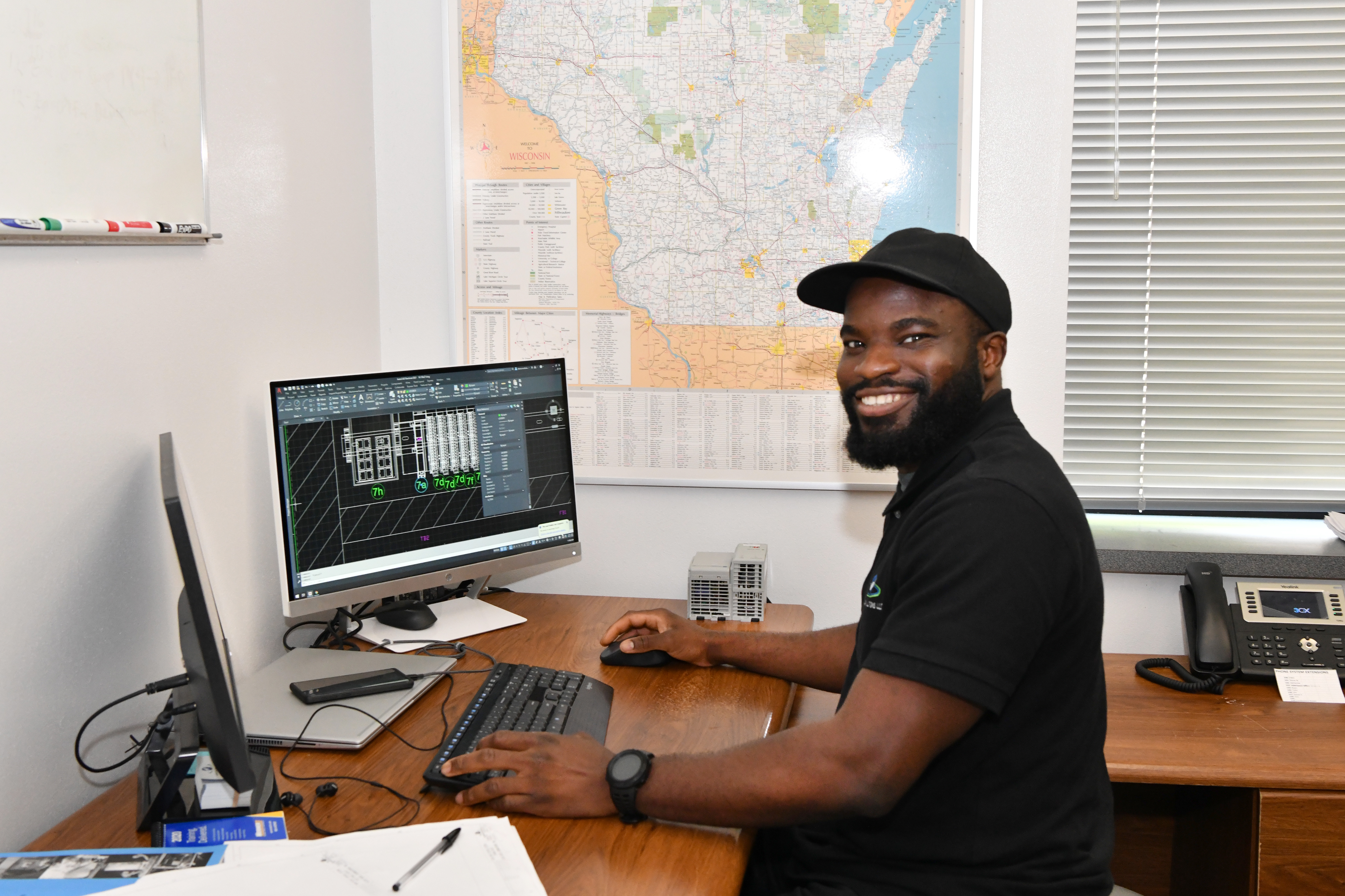 A man works on designs at Automation Solutions.